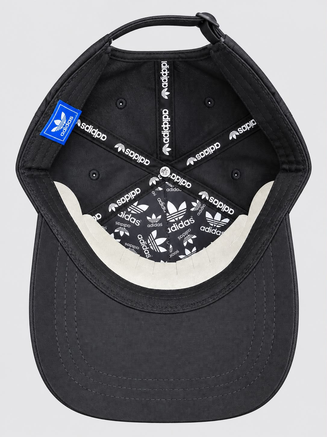 Interior de la gorra Adidas Originals 1949 gris oscuro con cintas de logos blancos
