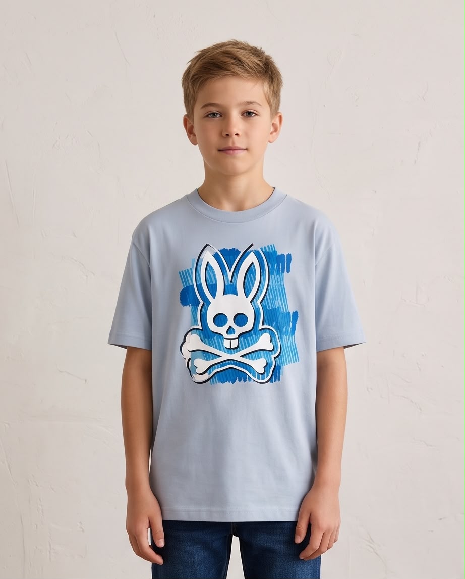 Camiseta Niño Psycho Bunny Calavera Blanca Pinceladas Azules Azul Cielo Semi Oversize
