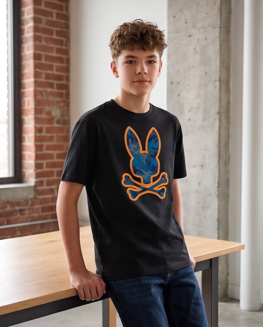 Camiseta Niño Psycho Bunny Camuflado Azul Contorno Naranja Negra Semi Oversize